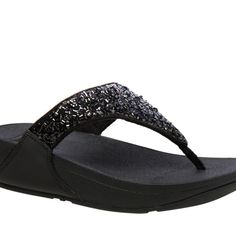 Nitb Fitflop Lulu Sandle With Summer Sparkle Black This Style Come In Whole Numbers Only. We Will Round Up Her Order. Upper: Foil-Covered Fabric, Faux Leather Upper; Triangular Vamp Design: Slip-On Thong Sandal Toe Type: Open, Round Back: Open Lining: Padded Microfiber Midsole: Supercushioned, Microwobbleboard Sole: Rubber Size & Measurements Size Choices: 5 To 11 (Whole Sizes Only) Back Heel Height: Approx. 1.5"H Rubber Wedge Unit Fit: True To Size Black Synthetic Toe Post Sandals, Black Toe Post Synthetic Sandals, Black Toe Post Flip Flops For Party, Party Black Synthetic Flip Flops, Black Non-slip Flat Heel Flip Flops, Comfortable Black Slip-on Flip Flops, Black Non-slip Flat Flip Flops, Black Leather Slip-on Flip Flops, Fitflop Shoes