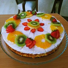 there is a cake that has fruit on it