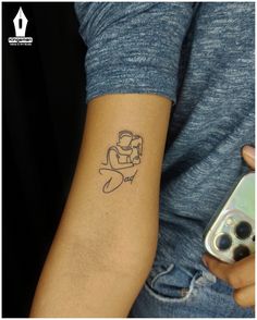 a person with a small tattoo on their arm