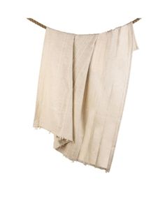 a white towel hanging on a clothes line