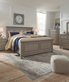 a bedroom with a bed, dresser and mirror