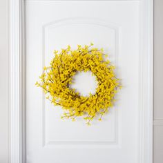 a door with a yellow wreath on it