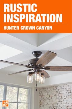 the hunter crown canyon ceiling fan is shown in an orange and white room with brick walls