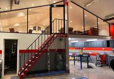 the inside of a garage with stairs leading up to it