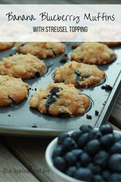 banana blueberry muffins with streusel topping in a muffin tin