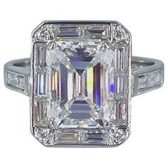 an emerald cut diamond ring with baguetts