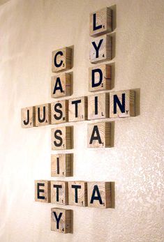 several scrabble tiles are arranged on the wall