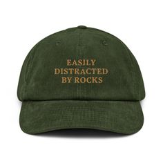 🎉 "Easily Distracted by Rocks" Embroidered Corduroy Hat 🪨✨ A hat made of corduroy? That's a yes! Our "Easily Distracted by Rocks" embroidered corduroy hat is the ultimate accessory for geology enthusiasts, nature lovers, and anyone who can't resist the allure of a cool rock. Whether you're a student, a seasoned geologist, or just love exploring the great outdoors, this hat is a fun and stylish way to show off your passion. Key Features: 🪨 100% Cotton Corduroy: Enjoy the softness, durability, Easily Distracted By Rocks, D&d Gifts, Nature Clothes, Fun Hats, Embroidered Corduroy, Silly Hats, Corduroy Hat, Funny Hats, Valerian