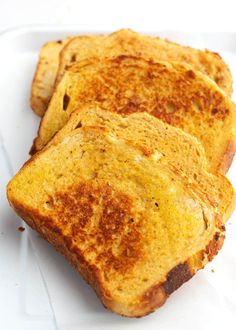 three pieces of toast sitting on top of a white plate