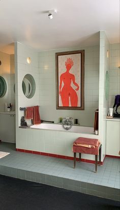 a bath room with a large painting on the wall and a bench in front of it