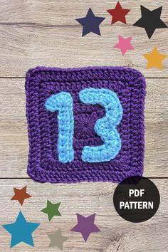 a crocheted square with the number 13 on it and stars in the background