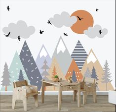 two children's chairs and table in front of a wall mural with birds flying over the mountains