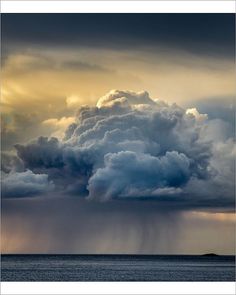 an image of storm clouds over the ocean