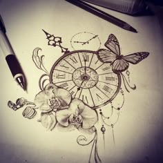 a pencil drawing of a clock with flowers and butterflies on it next to a pen