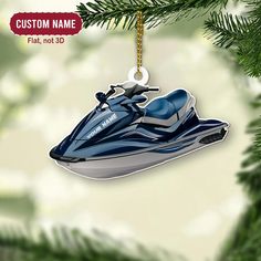 a blue jet ski ornament hanging from a christmas tree