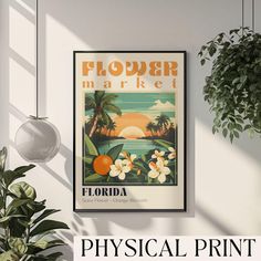 there is a poster on the wall next to a potted plant and some plants