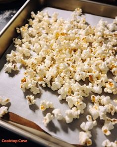 a pan filled with popcorn sitting on top of a counter