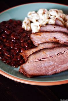 meat, beans and macaroni on a plate