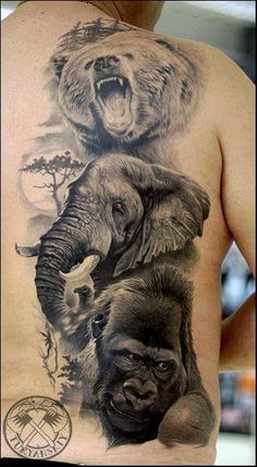 an elephant and bear tattoo on the back of a man