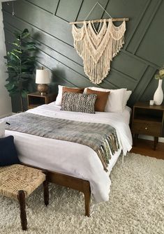 a bedroom with a large bed and two night stands