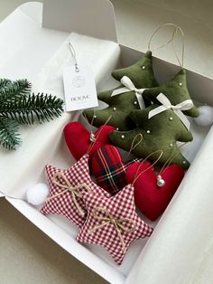 christmas ornaments are in a box on the table