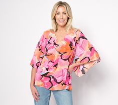 This gorgeous chiffon blouse makes a statement and pairs perfectly with anything from shorts to skirts to slacks. From Belle by Kim Gravel. Pink V-neck Chiffon Top, Spring Chiffon Blouse With Stretch, Summer Stretch Printed Blouse, Pink Floral Print Chiffon Tops, Summer Chiffon Top For Day Out, Pink Chiffon Tops For Beach, Chiffon V-neck Blouse For Vacation, V-neck Chiffon Blouse For Vacation, Trendy Chiffon Tops For Vacation