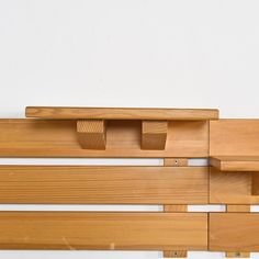 a close up of a wooden shelf on a wall