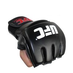 a close up of a person's hand wearing black boxing gloves with white lettering on it