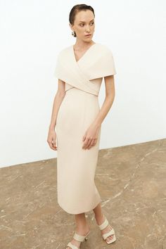 Elegant Beige Midi Dress With Surplice Neckline, Formal Midi Dress With Draped Sleeves And Surplice Neckline, Elegant Workwear Dresses With Cape Sleeves, Cocktail Wrap Dress With Draped Sleeves, Elegant Bodycon Dress With Surplice Neckline, Chic Fitted Wrap Dress With Draped Sleeves, Chic Midi Dress With Cape Sleeves For Work, Elegant Wrap Dress With Draped Sleeves, Elegant Beige Short Sleeve Bodycon Dress