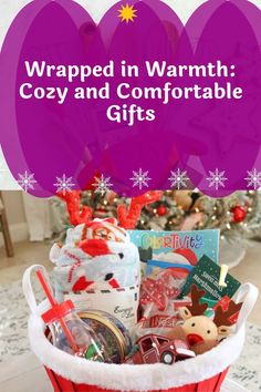 a red basket filled with christmas items and the words wrapped in warmth cozy and comfortable gifts