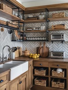 a kitchen with wooden cabinets and open shelves