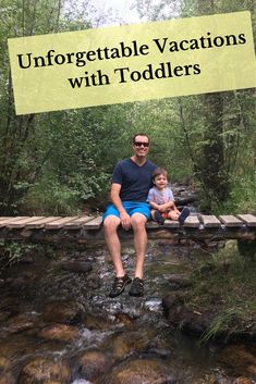 a man sitting on top of a wooden bridge next to a small child