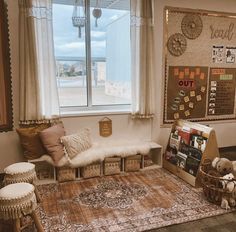 a living room filled with furniture next to a window and a rug on the floor