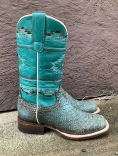 These Roper boots are designed with comfort, durability, quality materials and craftsmanship in mind! When you put these roper boots, you exude timeless western fashion. Vintage Turquoise/Brown Backcut Pythin Aztec Embroidered Design Shaft Square Toe Double Welt 11" Shaft 1.25" Walking Heel Circumference of Calf: 15" REST Removable Insole Measurements for this boot were taken from a size 7.5. Please note that measurements may vary by size. Western Turquoise Boots With Patina, Turquoise Western Boots With Patina, Fitted Turquoise Boots For Ranch, Western Green Snip Toe Boots, Western Turquoise Boots For Rodeo, Turquoise Western Boots For Ranch, Southwestern Style Round Toe Boots For Ranch, Western Style Boots With Patina For Western-themed Events, Blue Western Boots For Ranch