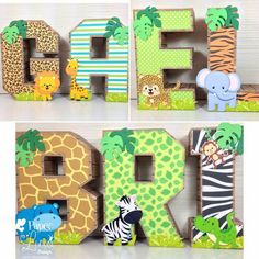 the letters are made out of wood and decorated with animals, giraffes and zebras