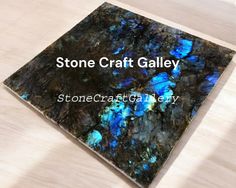 a stone craft gallery with blue flowers on it and the words stonecraft gallery above it