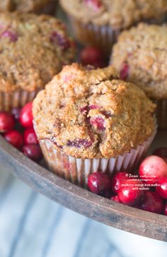 muffins and cranberries on a wooden tray