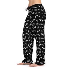 "Introducing our \"Bats and Bones\" Print Pajama Pants for Women, a stylish and comfortable choice for those who embrace the dark side with a touch of mystery. These pajama pants feature a captivating design with bats and bones, perfectly capturing the essence of the gothic aesthetic. Crafted with soft and breathable fabric, they offer both coziness and style for a restful night's sleep. Embrace your unique sense of fashion and indulge in the dark charm of these pajama pants. Whether worn for lo Wide Leg Pants With Elastic Waistband For Bedtime, Cotton Long Pants For Home, Black Pants With Elastic Waistband For Sleepover, Black Elastic Waistband Pants For Sleepover, Black Bottoms For Sleepover, Black Long Pants For Pajama Party, Pajama Pants Outfit, Matching Pajama Pants, Matching Pajama