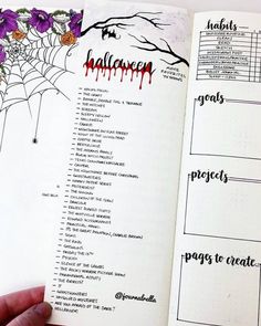 a hand is holding an open halloween planner