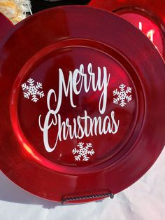 two red plates with merry christmas lettering on them