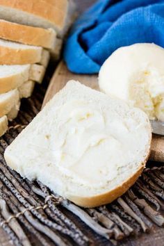 sliced bread and butter on a wooden cutting board