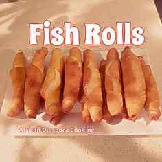 five pieces of fish rolls on a white platter with the words, fish rolls african diaspora cooking