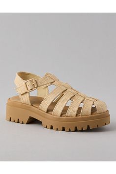 Raffia upper/Adjustable strap with buckle closure/Rubber lug outsole Casual T-strap Sandals With Buckle Closure For Vacation, Casual T-strap Sandals With Buckle For Vacation, Closed Toe T-strap Sandals With Buckle For Vacation, Vacation T-strap Closed Toe Sandals With Buckle, Beach T-strap Sandals With Buckle, T-strap Footbed Sandals With Buckle For Beach, T-strap Footbed Sandals With Buckle Closure For Beach, Round Toe T-strap Sandals With Buckle For Vacation, Vacation T-strap Sandals With Buckle And Round Toe