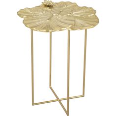 a gold metal side table with a flower on it