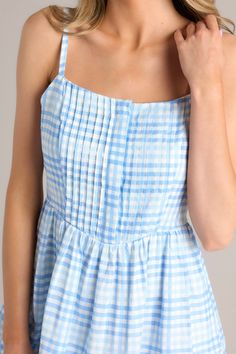 I have to say, you're looking so Alive And Free in this fun blue gingham romper dress! You can make any day more colorful and carefree when you show up in this lighthearted mini! This blue gingham romper features a square neckline, adjustable straps, hidden functional buttons down the front of the bust, pleated detailing at the waistline, a side zipper, and a flowy skirt overlaying the shorts hidden underneath. 55% Linen, 45% Rayon Hand Wash Cold Lined 55% Linen, 45% Rayon Imported Model is wear Blue Sundress With Adjustable Straps And Square Neck, Blue Plaid Dress For Spring Picnic, Blue Square Neck Sundress With Adjustable Straps, Blue Plaid Mini Dress For Picnic, Summer Gingham Dress With Square Neck, Blue Plaid Dress For Summer Picnic, Blue Square Neck Dress For Picnic, Summer Gingham Dress With Adjustable Straps, Spring Gingham Plaid Dress With Square Neck