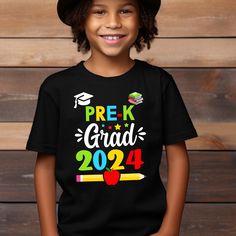 Celebrate your little one's graduation from Pre K in style with our 2024 Preschool Grad Shirt! This adorable t-shirt is perfect for both boys and girls, featuring a custom design with your child's graduation year prominently displayed.  Whether your child is graduating from preschool or kindergarten, this shirt is a great way to commemorate this special milestone in their educational journey.  Our graduation t-shirt is also a great gift idea for friends and family with young graduates. Available Black T-shirt For Back To School Events, Black Short Sleeve Tops For School Events, Black Tops For School Events And Back To School, School Spirit T-shirt For Birthday And Back To School, Crew Neck Tops For Graduation, School Spirit Tops For Graduation Gift, Black Pre-shrunk T-shirt For Graduation Gift, Black T-shirt With Letter Print For School Events, Black Short Sleeve T-shirt For Graduation Gift