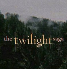 the twilight saga logo with trees in the background