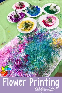 flower printing art for kids with paper plates and flowers on the table in front of them