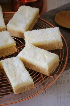 several pieces of cake sitting on top of a cooling rack