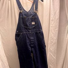 Introducing The Classic And Versatile Sears Brand Tradewear Overalls A Must-Have For Both Men And Women Seeking Comfort, Durability, And Practicality. These Overalls Are Size 36x30, Suitable For A Range Of Body Types, Ensuring A Comfortable Fit. The Rich Blue Color Is Iconic, Easy To Match, And Excellent For Hiding Everyday Wear And Tear, Making This Garment As Practical As It Is Stylish. Crafted From High-Quality Denim, These Overalls Are Designed To Withstand The Rigors Of Both Work And Leisur Storage For Tools, Body Types, Wear And Tear, Mens Pants, Overalls, Everyday Wear, Comfort Fit, Adjustable Straps, Sweatpants